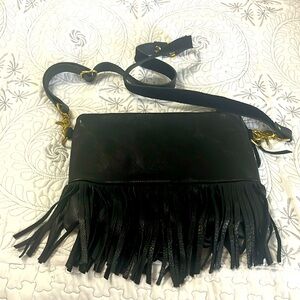 Raise case fringe purse!!! All leather and well made. No issues